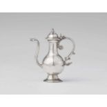 An Amsterdam miniature silver wine carafePear form vessel on waisted base with hinged lid and scroll