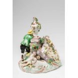 A Vienna porcelain shepherd groupFour figure group with a sheep and a ram surrounding a central