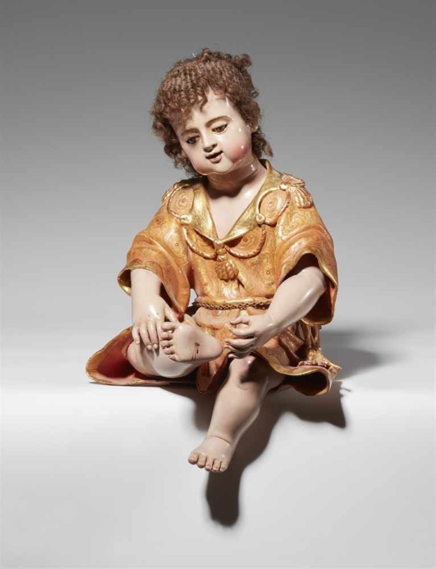 An Italian terracotta model of the Christ Child as the "Spinario"Painted terracotta model with