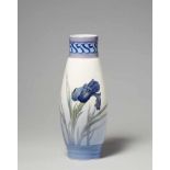 A Copenhagen porcelain vase with an irisTall slender vase painted with a vivid blue iris flower to