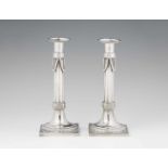 A pair of Augsburg silver candlesticksFluted shafts on square plinths. H 25 cm, weight 674 g.