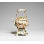 A Meissen porcelain teapot and rechaudWith the original gilt metal mountings. Of flattened rounded