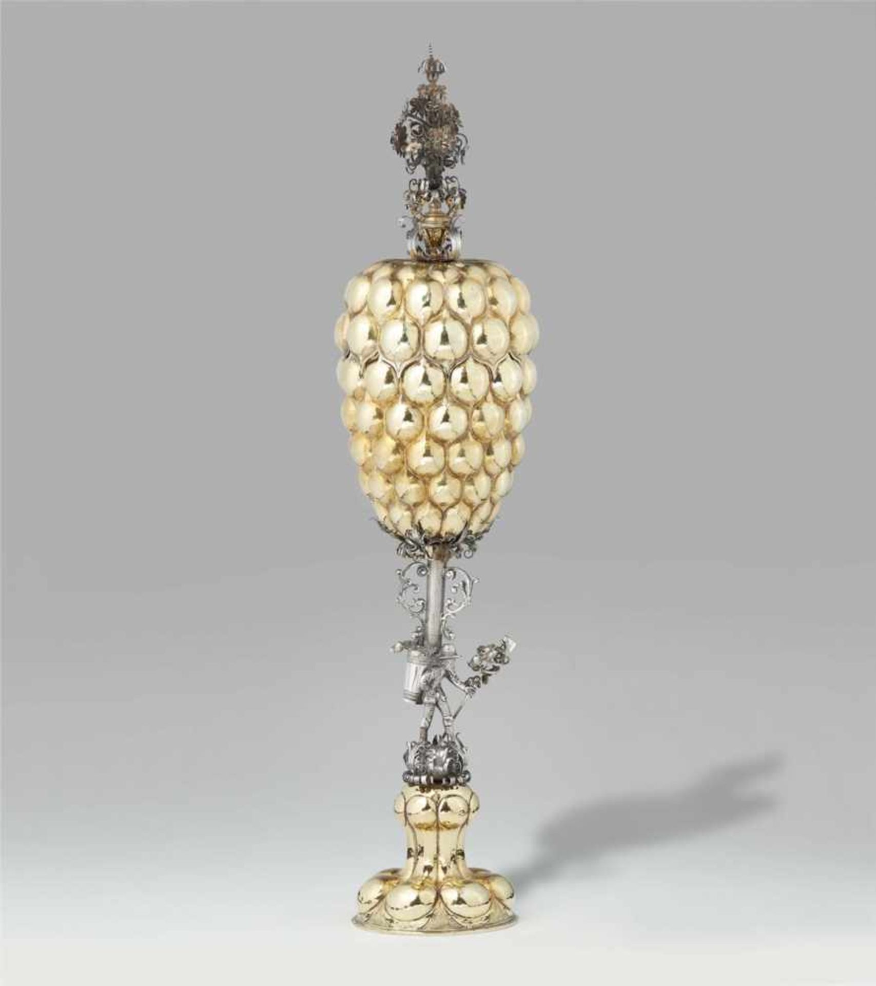 An important Renaissance parcel gilt silver goblet with a "büttenmann" motifGadrooned base