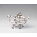 An Antwerp silver sauce boatRounded facetted form on four supports. Monogrammed to the underside "