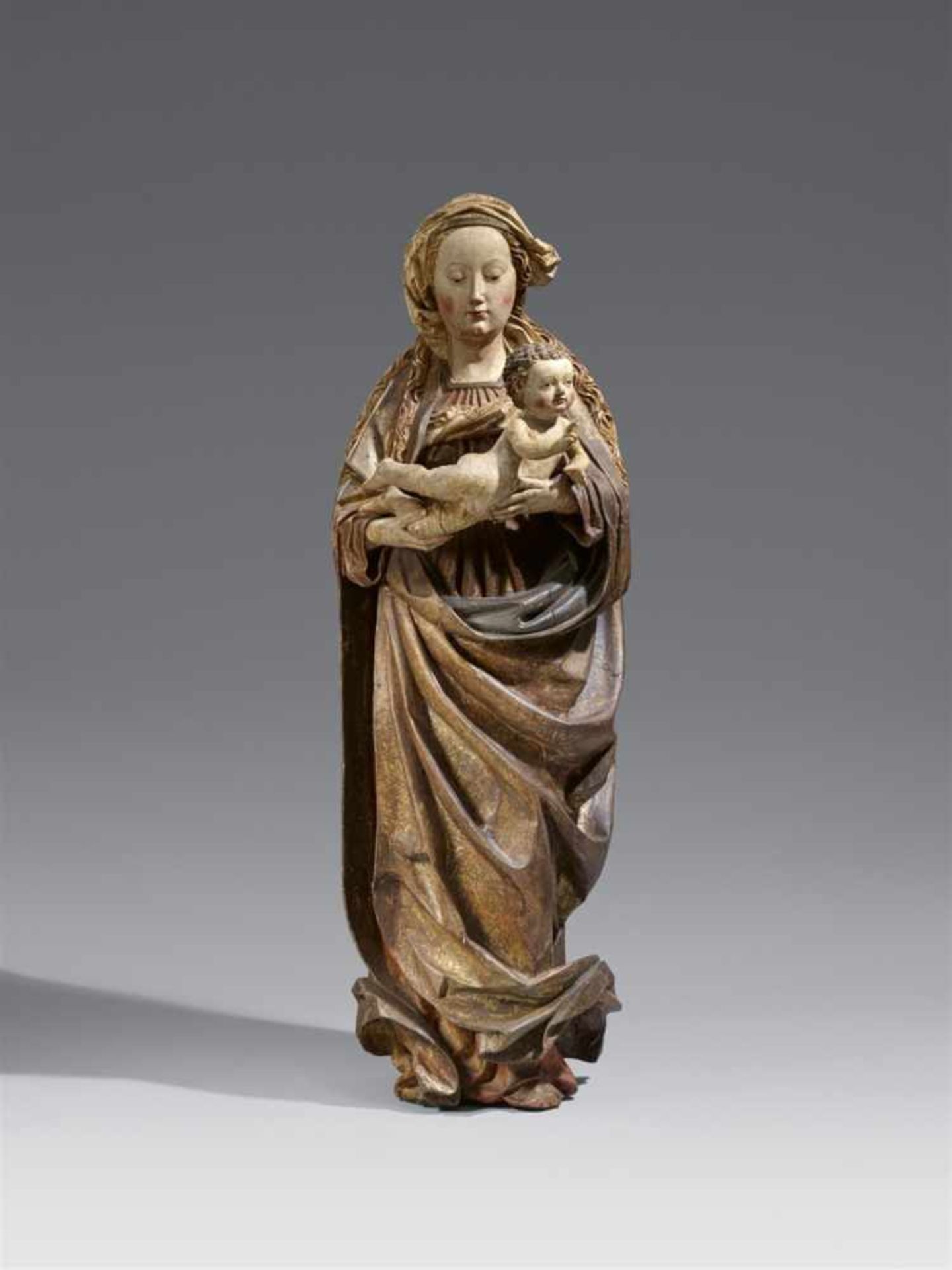 A Swabian carved limewood figure of the Virgin and Child, circa 1480/90The reverse flattened and