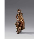 An 18th century carved wood personification of winter, probably FlemishCarved three-quarters in