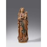 A late 15th century Franconian carved wood figure of the Virgin and ChildCarved three-quarters in