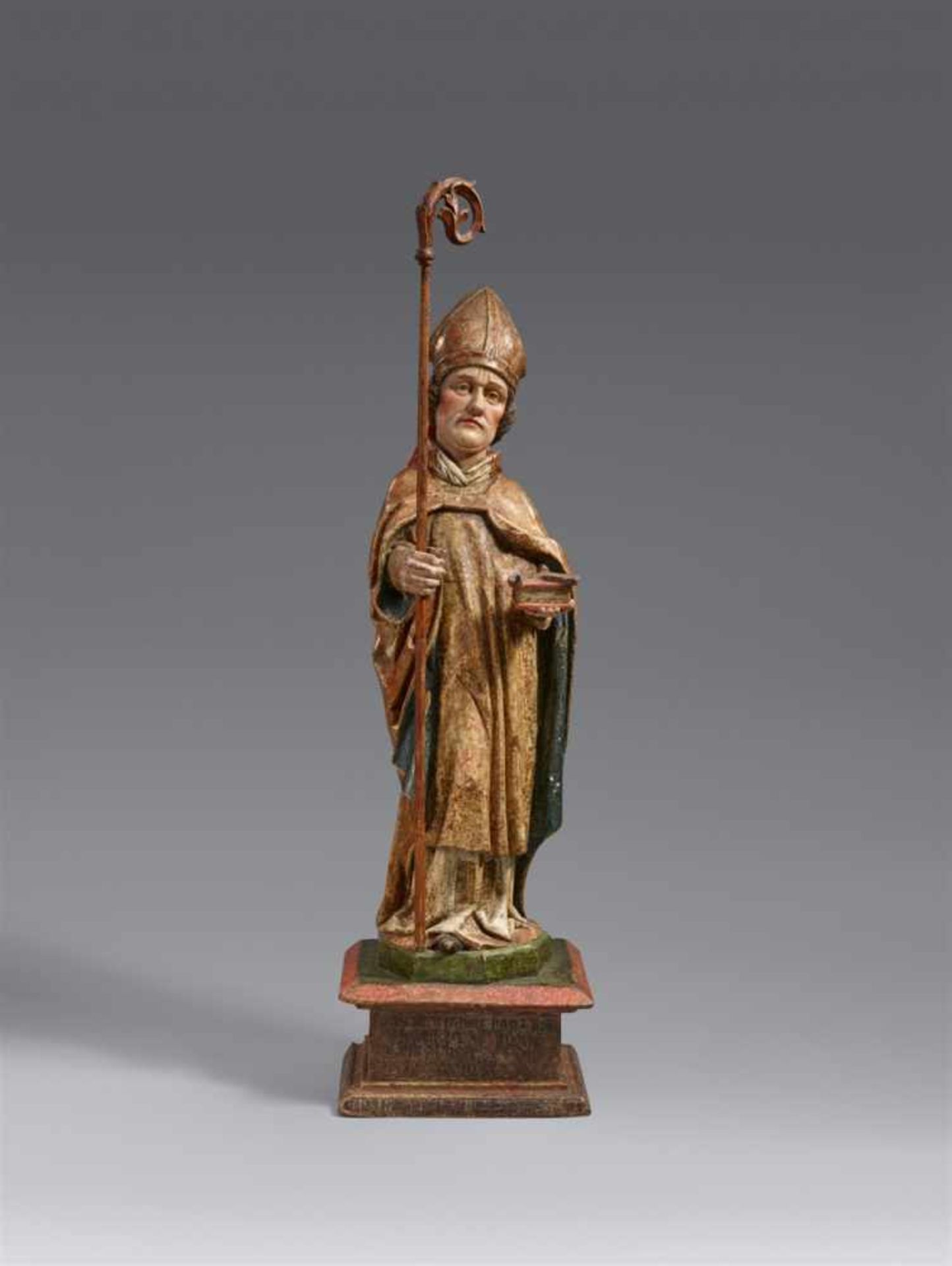 A carved wood figure of Saint Eligius by Hans KlockerCarved in the round, the reverse partially