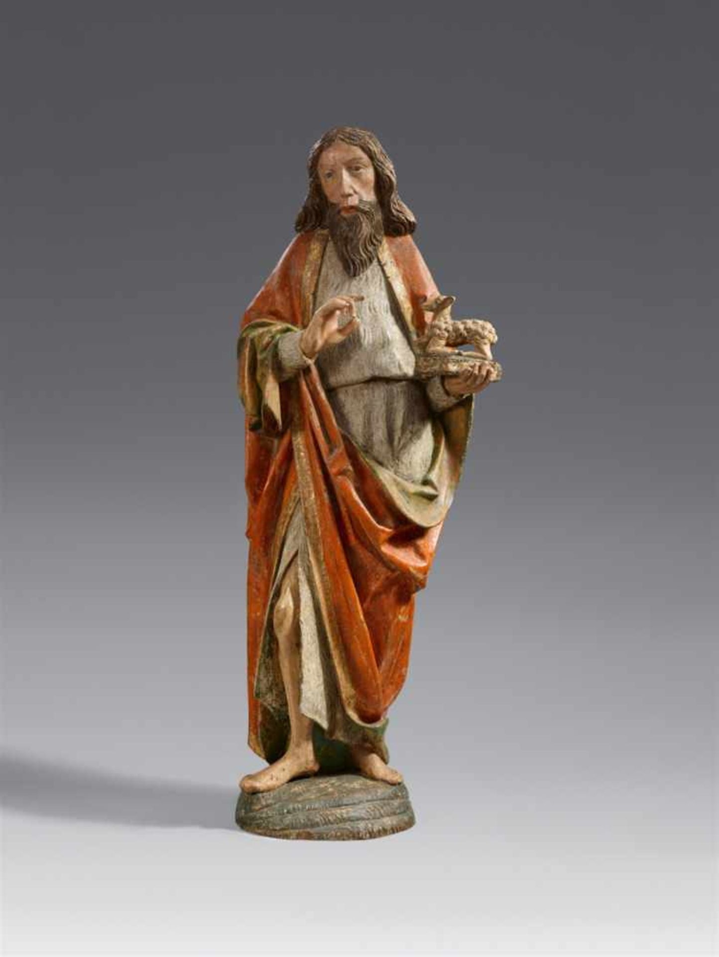 A carved wood figure of John the Baptist, circle of Erasmus GrasserCarved three-quarters in the