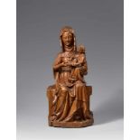 A Lower Rhenish carved wood figure of Saint Anne Teaching the Virgin to Read, circa 1350Probably