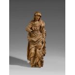 A carved limewood figure of Saint Elisabeth, circle of Michael Zürn the ElderCarved three-quarters