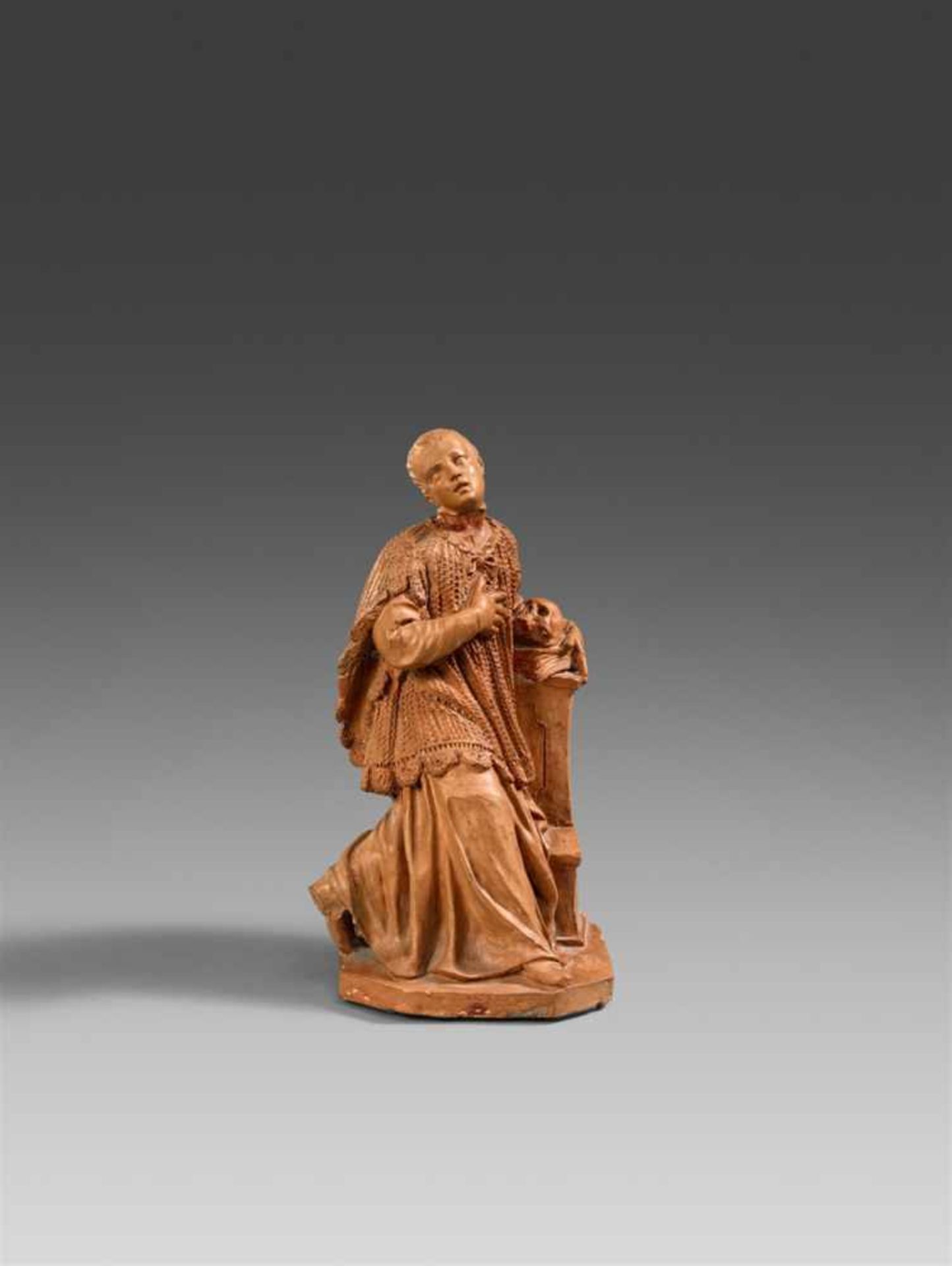 A terracotta figure of Saint Aloysius Gonzaga, attributed to Pierre Legros the YoungerWorked in