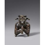 A Netherlandish cast bronze figure of a court jester, second half 15th centuryEngraved bronze figure