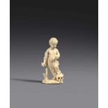 A 17th century carved ivory figure of Christ with a skull, probably South GermanCarved in the