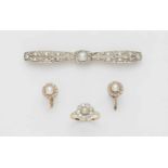 A Belle Epoque demi-parurePlatinum and 14k gold demi-parure comprising a cluster set ring and