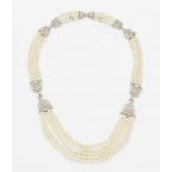 A Belle Epoque pearl necklaceFive-strand necklace of tiny natural river pearls held by four