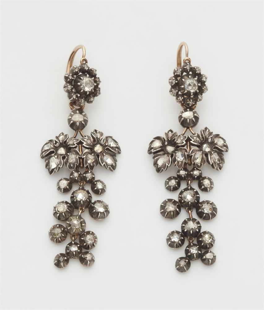 A pair of Parisian pendeloque diamond earringsSilver and 18k red gold earrings designed as a rosette