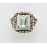 A Victorian aquamarine ringSilver and gold ring with moulded band and diamond set shoulders flanking