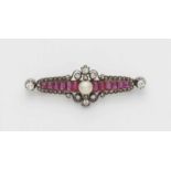 A Belle Epoque ruby broochSilver and 14k gold pin brooch set with antique cut natural rubies (in