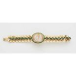 An 18k gold Louis Philippe cameo braceletHinged adjustable repousse braided pattern band. The