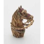 An 18k gold and gemstone model of a horse's headSculpted horse head with finely chased hair and