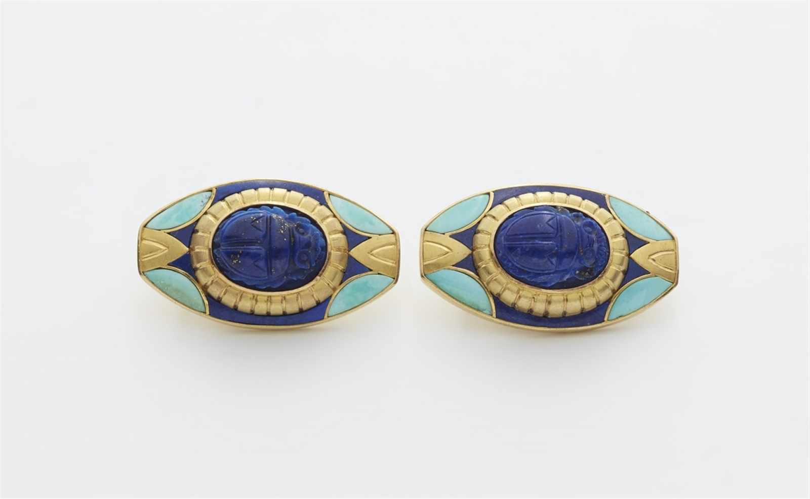A pair of Egyptian style 18k gold clip earringsMatching pieces to the bracelet. Hand-forged earrings