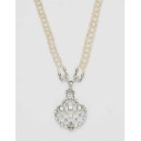 A seed pearl sautoir with a platinum and diamond pendantThe long braided seed pearl chain suspending