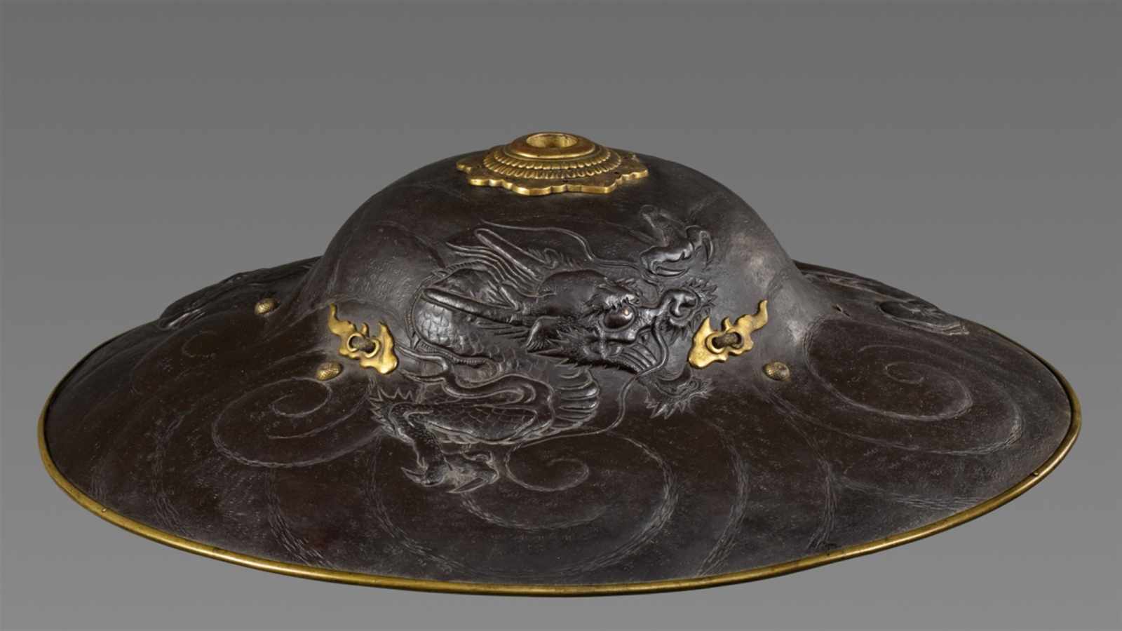 A Myochin school russet iron jingasa. Edo period