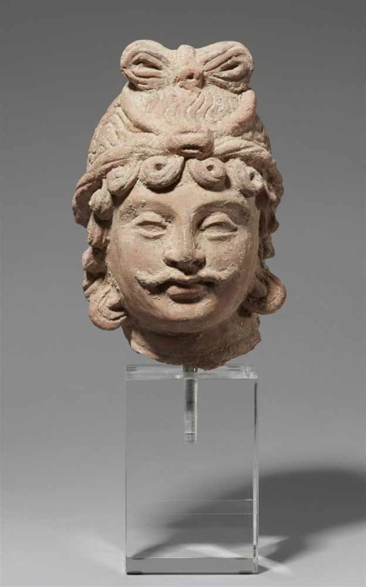 A Gandhara unfired clay head of a bodhisattva. Pakistan. 4th/5th century