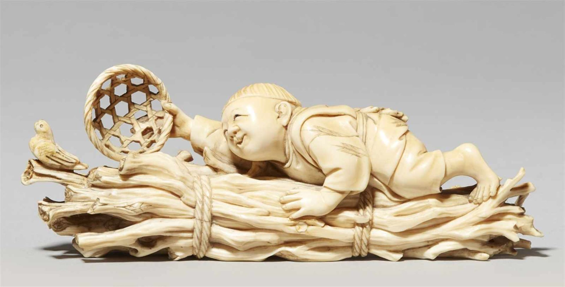 An ivory okimono of a boy. Late 19th century