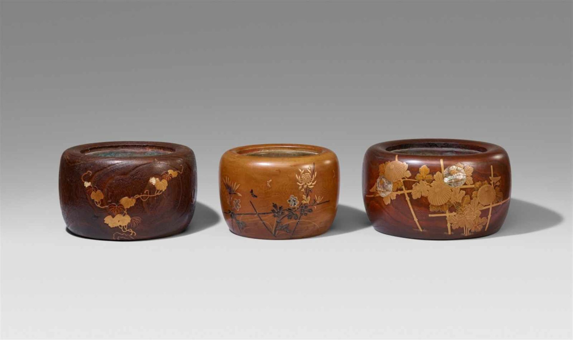 Three kiri wood hibachi with copper insets. Around 1900