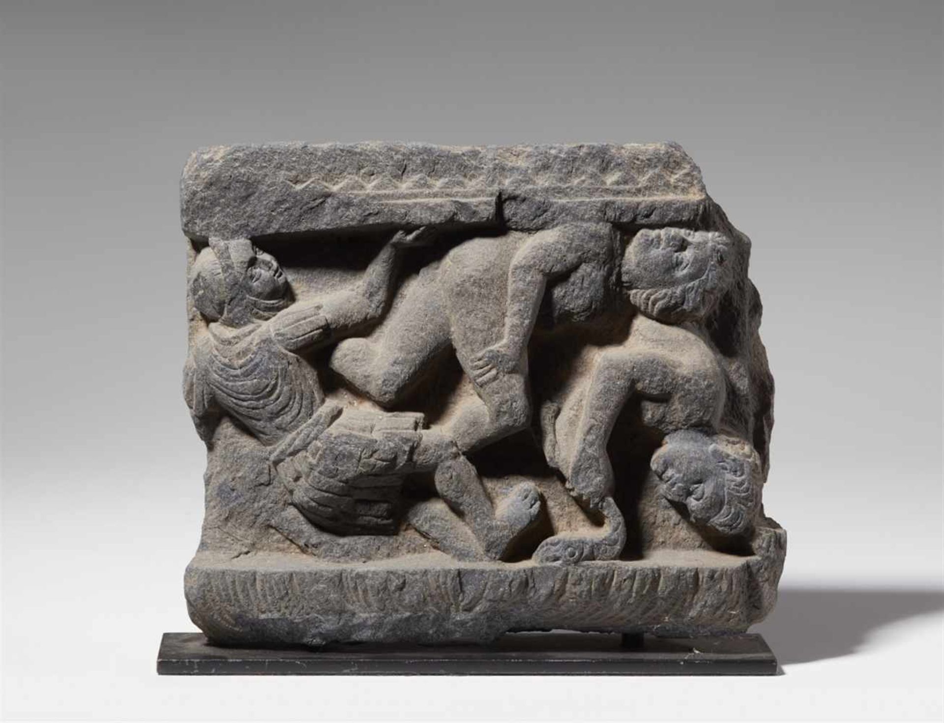 A Gandhara gray shist fragment, probably from the base of a stele. Pakistan. 2nd/3rd century
