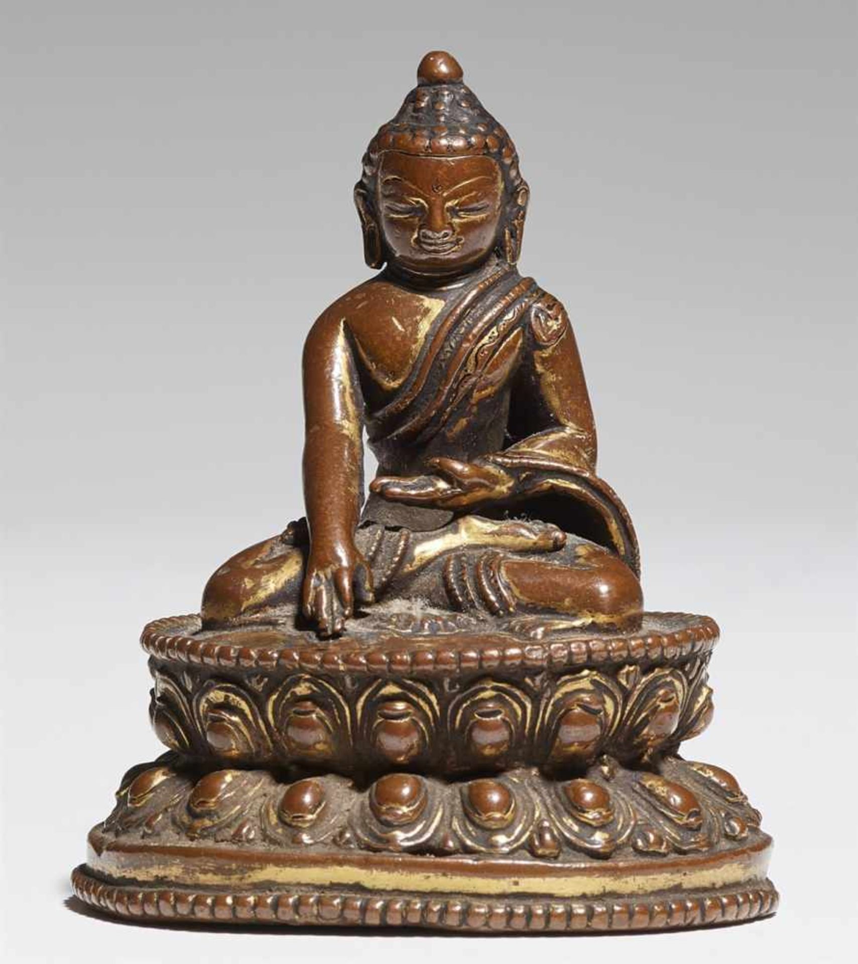 A small Nepalese bronze figure of Buddha Shakyamuni. 14th century