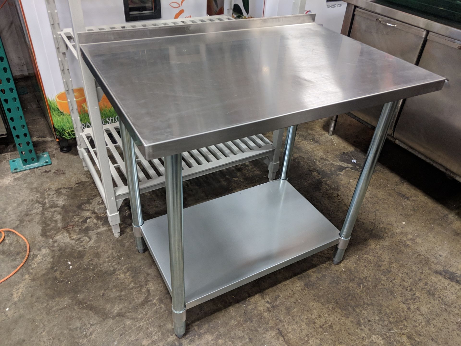 24" X 36" Stainless Work Table with 2" Backsplash