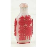 Glass snuff bottle with red and white overlay. China. Late 19th century.7,2 x 3,5 cm.