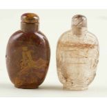 Lot of two snuff bottles. China. Mid 20th century.One is made of rock crystal with rutile