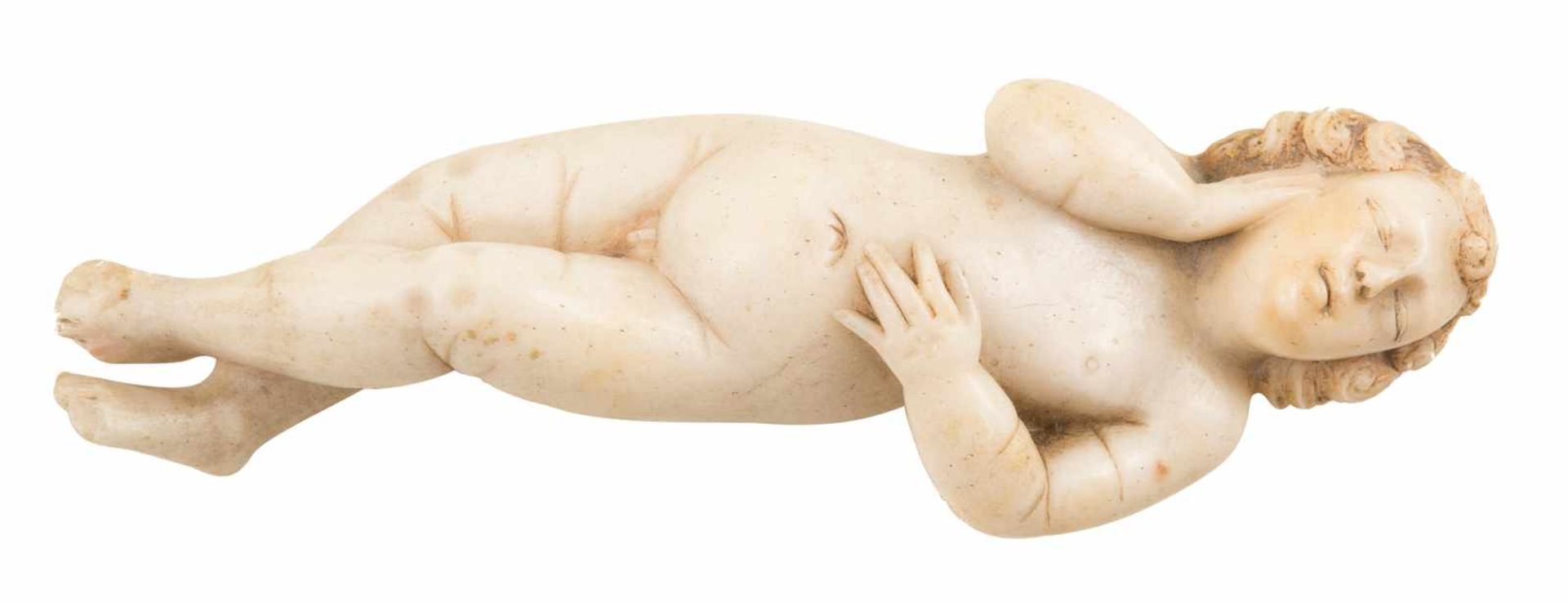 Sleeping child Carved alabaster figure with gilt residue on the hair. Renaissance. 16th century.