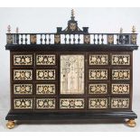 Ebonized wood bargueno chest with pyrography ivory plates. 17th – 18th century.The door has a