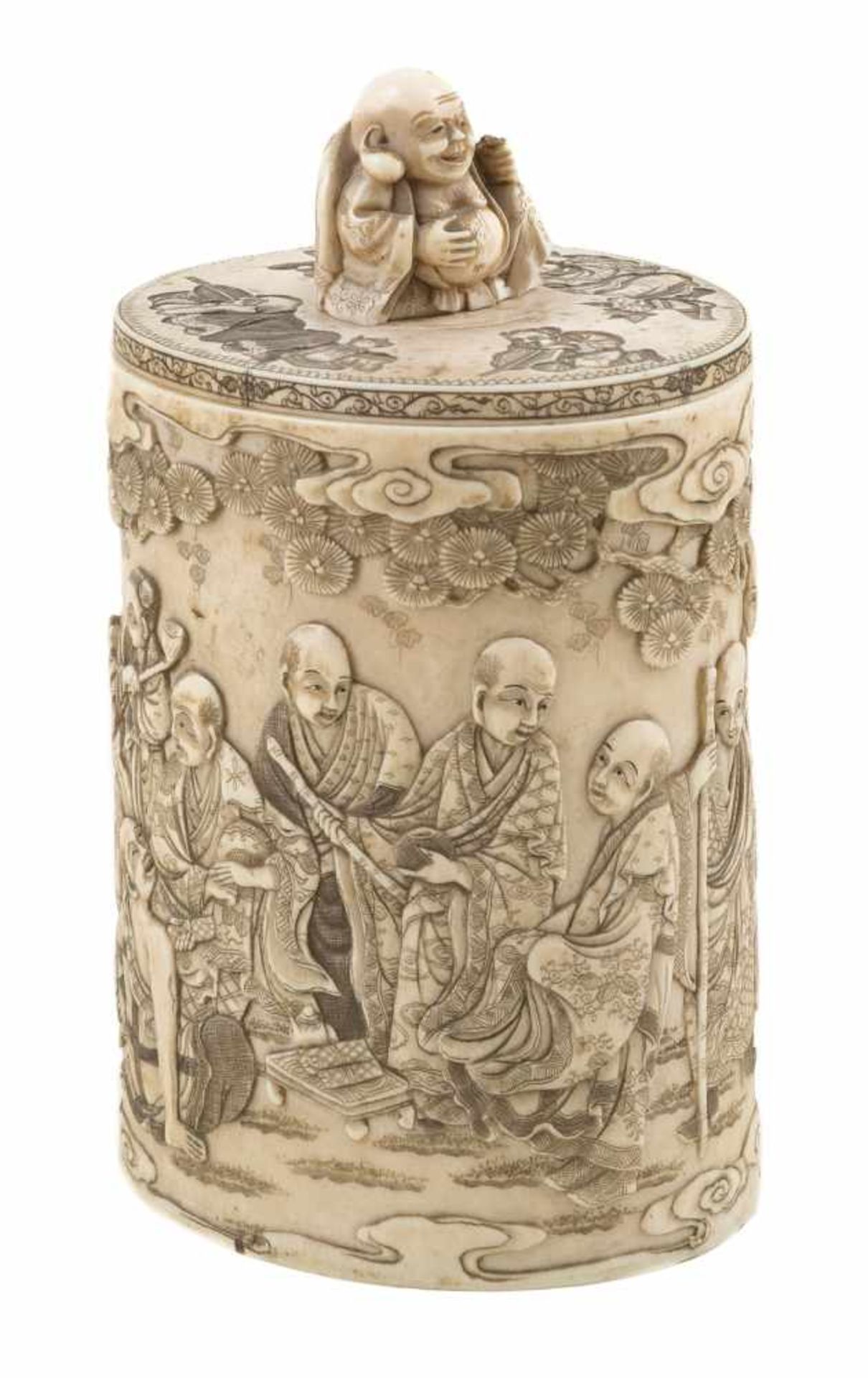 Sculpted ivory jar. Japan. Late 19th century.Decorated with Arhats under clouds and pine trees.