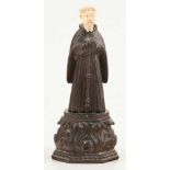"Franciscan monk” Sculpted wood and ivory figure. Indo-Portuguese. 17th – 18th century.Total height: