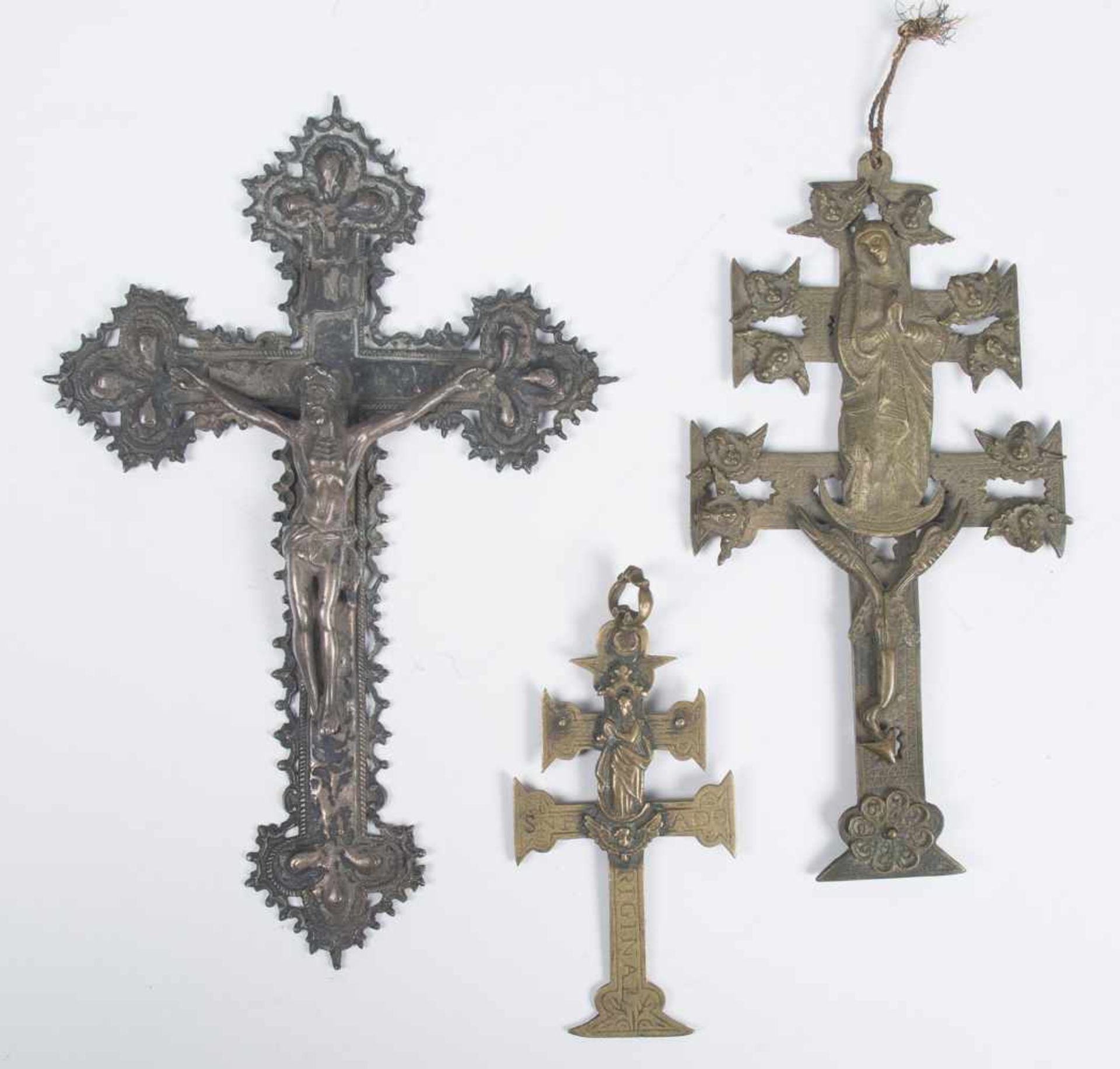 Collection of three crosses. Two are bronze Caravaca crosses and the third is made of silver. 18th –