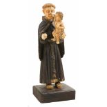 "Saint Anthony with the Christ Child" Sculpted ivory figure. Indo-Portuguese. 17th-18th century.