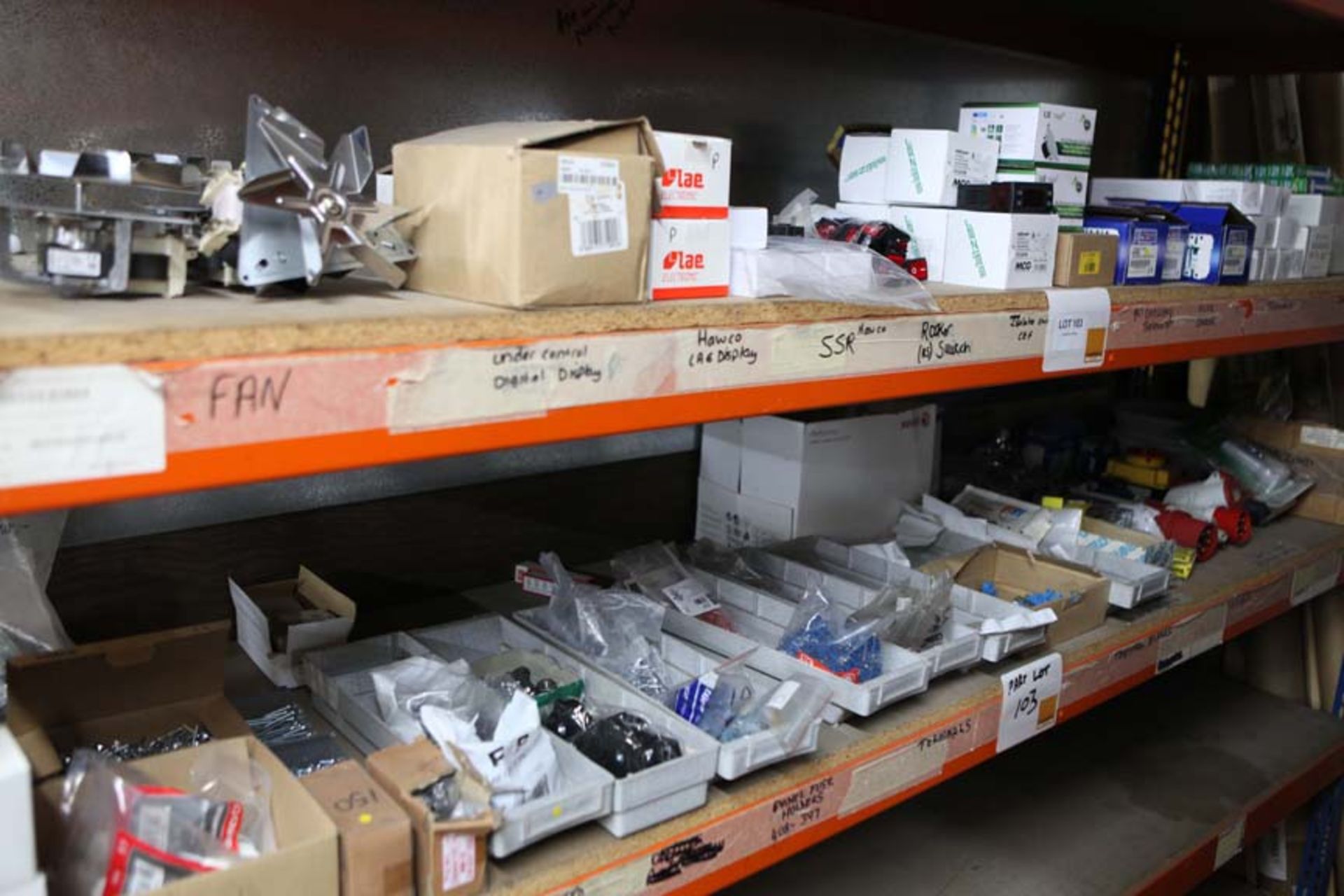 2 Shelves of electrical components and switches