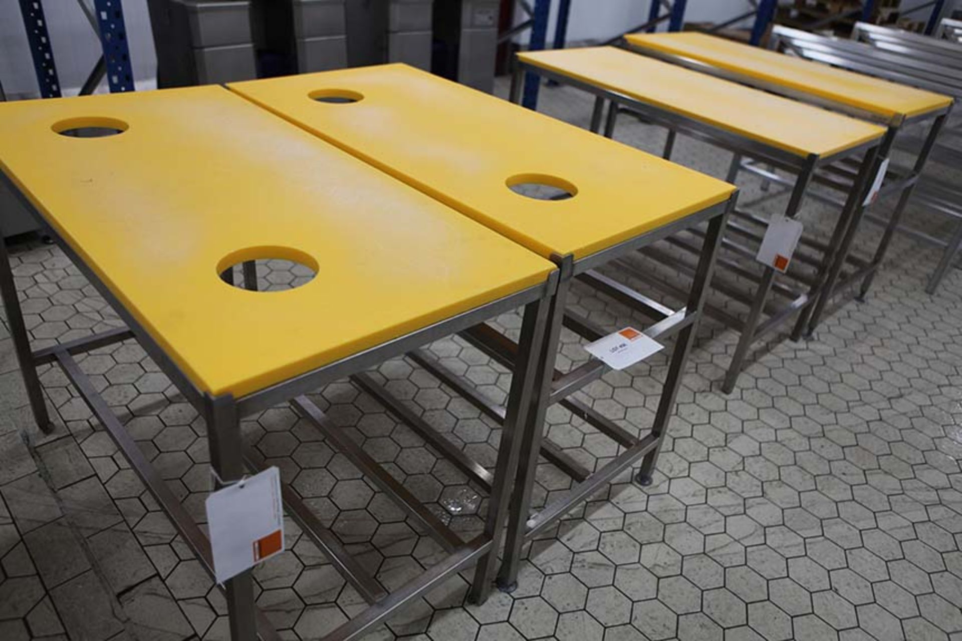 2 Meat preparation tables with Yellow tops and waste holes 1200 x 600 mm