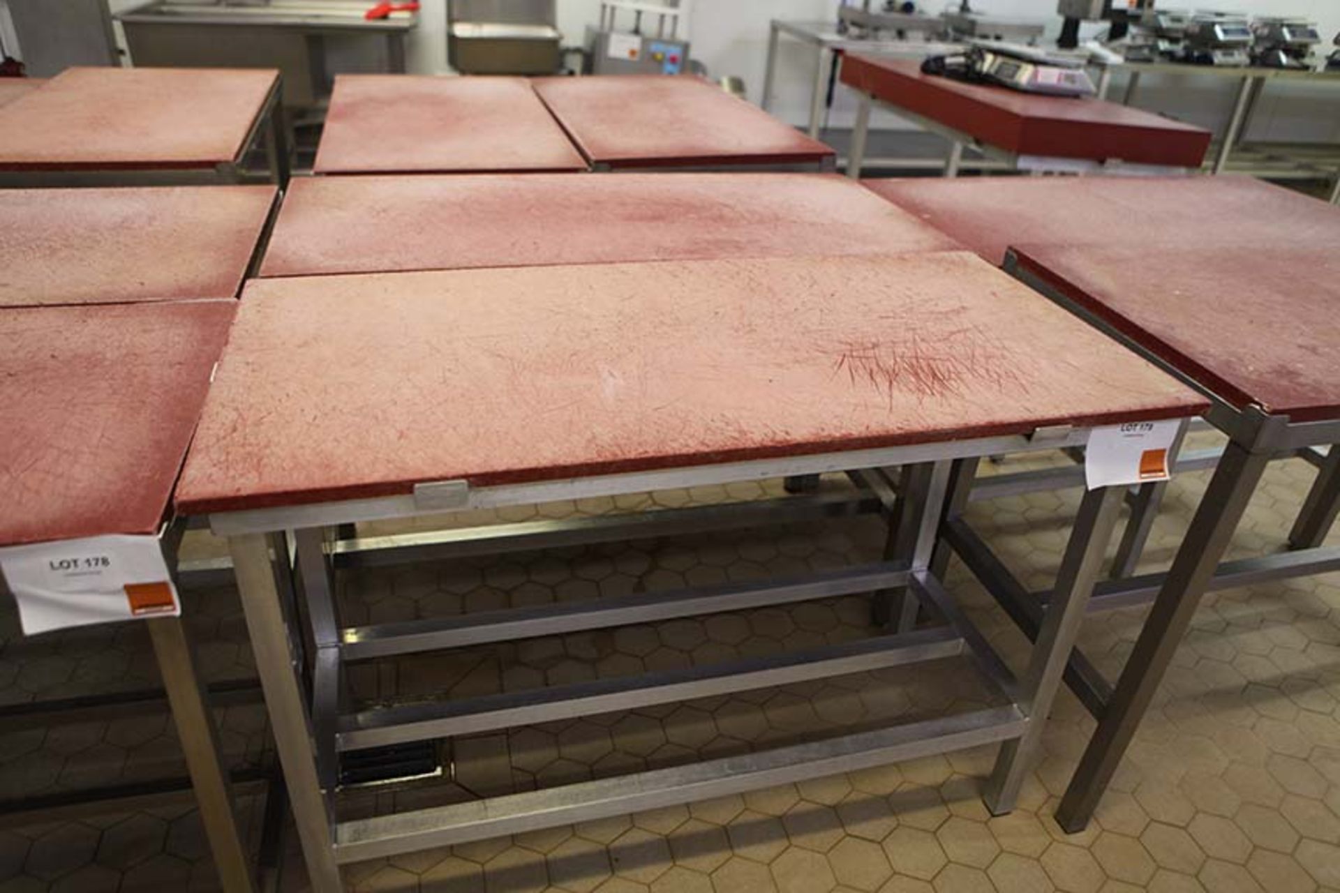 2 Meat preparation tables with Red tops 1200 x 600 mm