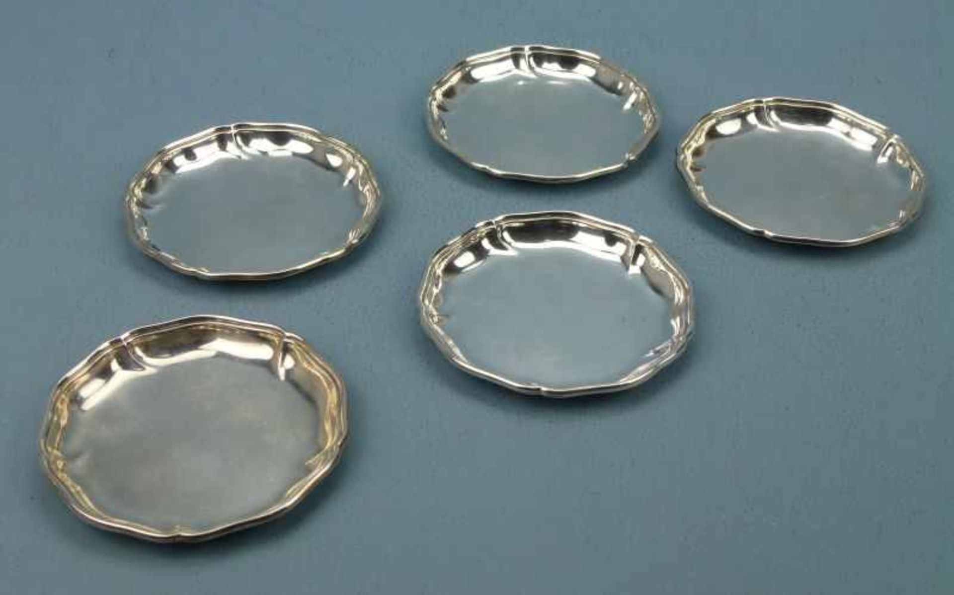 5 Glasuntersetzer, 835/925er Silber geschweifter Profilrand, Dm 10,5cm, 227 g