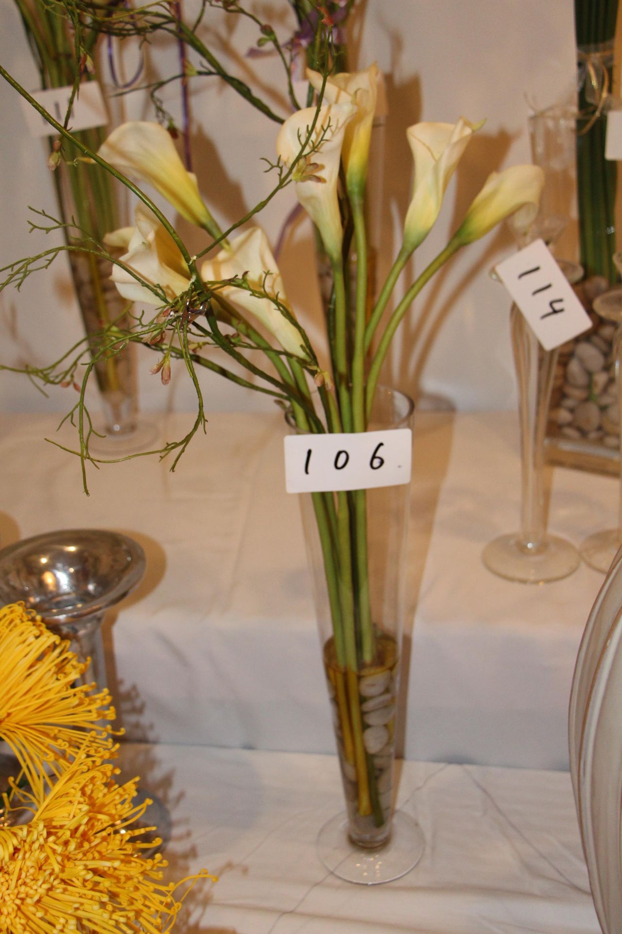 Faux flower arrangement w/ glass vase
