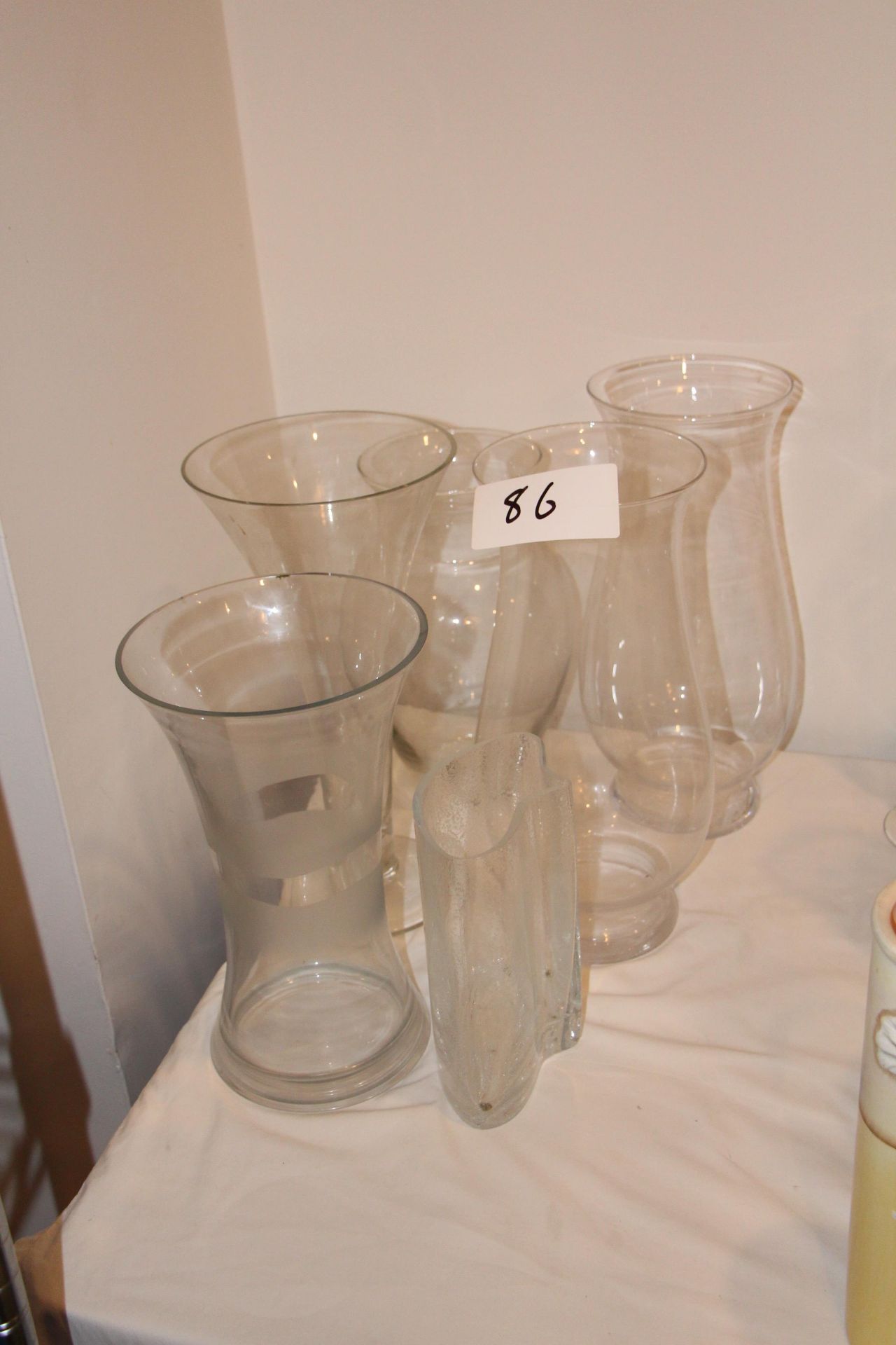 Lot assorted glass vases on table