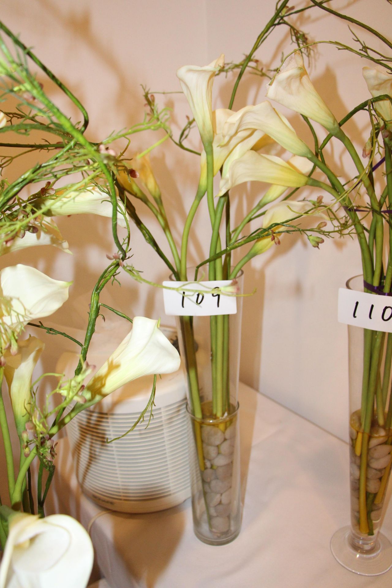 Faux flower arrangement w/ glass vase