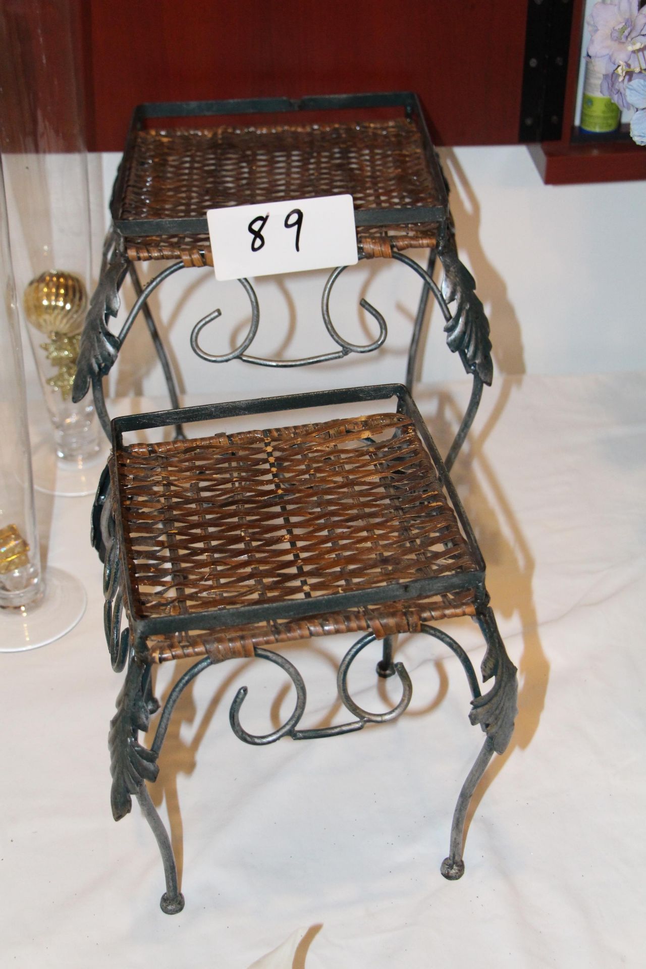 Lot 2 wrought iron stands w/ wicker top